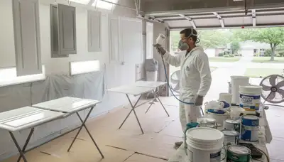 Professional cabinet painting in Lafayette, LA using spray techniques for smooth, durable kitchen finishes