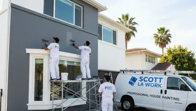 Professional house painters working on a home exterior in Lafayette, LA