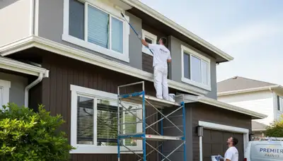 Professional trim and fascia painting on Lafayette, LA home exterior by expert house painters